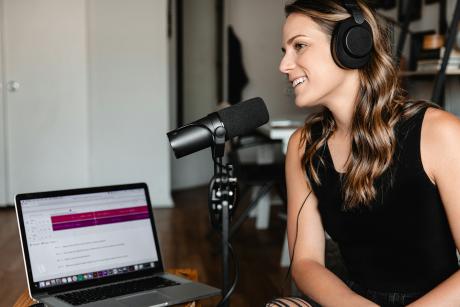 woman talking into a microphone