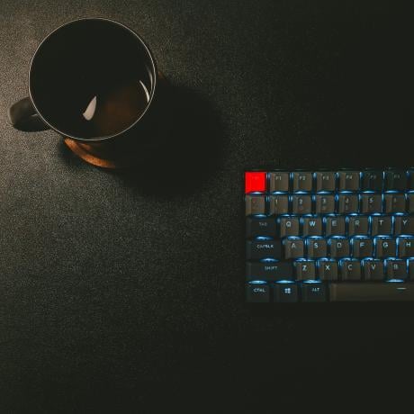 keyboard and black mug