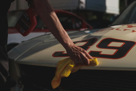 Man polishing the car hood