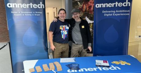 Developers Simon White and Daniel Pickering set up the Annertech booth at LocalGovCamp 2024