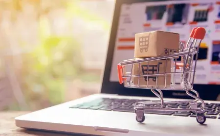 miniature shopping cart on a laptop