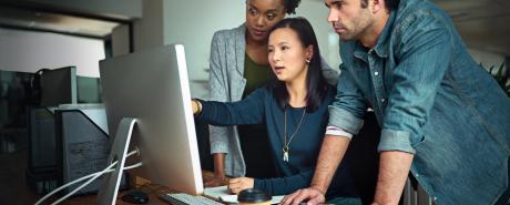 People works on a system in an office space