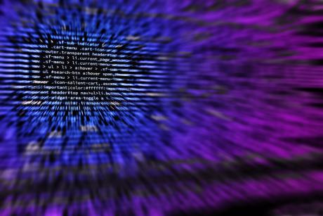 A blurred image of codes displayed on a screen