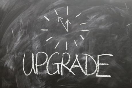 Graphical representation of 'Upgrade' written on a black board
