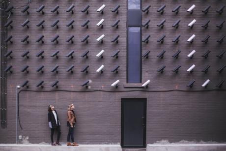 Women look at security cameras
