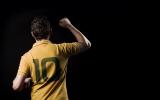 a person wearing Yellow coloured No. 10 jersey photographed from back