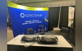 Specbee's Booth at DrupalCon Pittsburgh 2023 with Free GymBags to Distribute as Drupal Swag