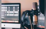 Black and silver headphones on black and silver microphone