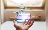 open palm with syringe and braces floating above