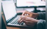 a person working in laptop