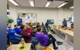 a group of people listening to a session