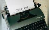 Tutorial written on a piece of paper lodged in a typewriter