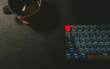 keyboard and black mug