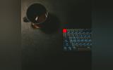 keyboard and black mug