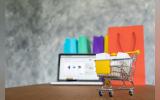 Laptop and shopping bags, online shopping concept