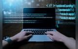 Programming background with person working with codes on computer