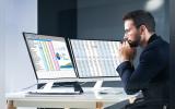 Someone working on a spreadsheet application on iMac