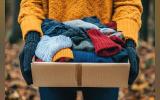 AI generated image of a pair of hand holding a box of woolen clothes