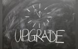 Graphical representation of 'Upgrade' written on a black board