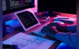 Close-up image of programer working at his desk in office