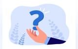 Business man's hand holding a question mark