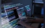Programming background with person working with codes on computer