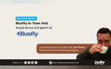 A wide Discover Drupal graphic shows John Money drinking from a white cup beside the Bluefly logo and a brown event callout. Text reads "DISCOVER DRUPAL. BlueFly.io Town Hall. Acquia Source and agentic AI. Bluefly. Live demonstration and Q and A with John Money. Director of Product Marketing at Acquia. Follow us on. https www.thedroptimes.com. THE DROP TIMES."