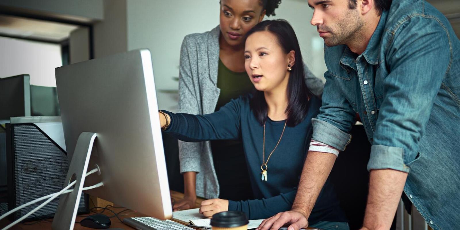 People works on a system in an office space